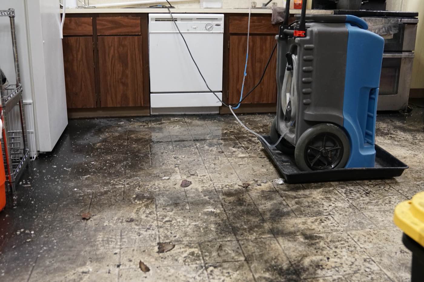 Restoration equipment drying a fire-damaged kitchen