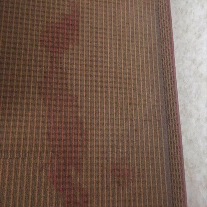 Red stain on commercial carpet before Summit treatment